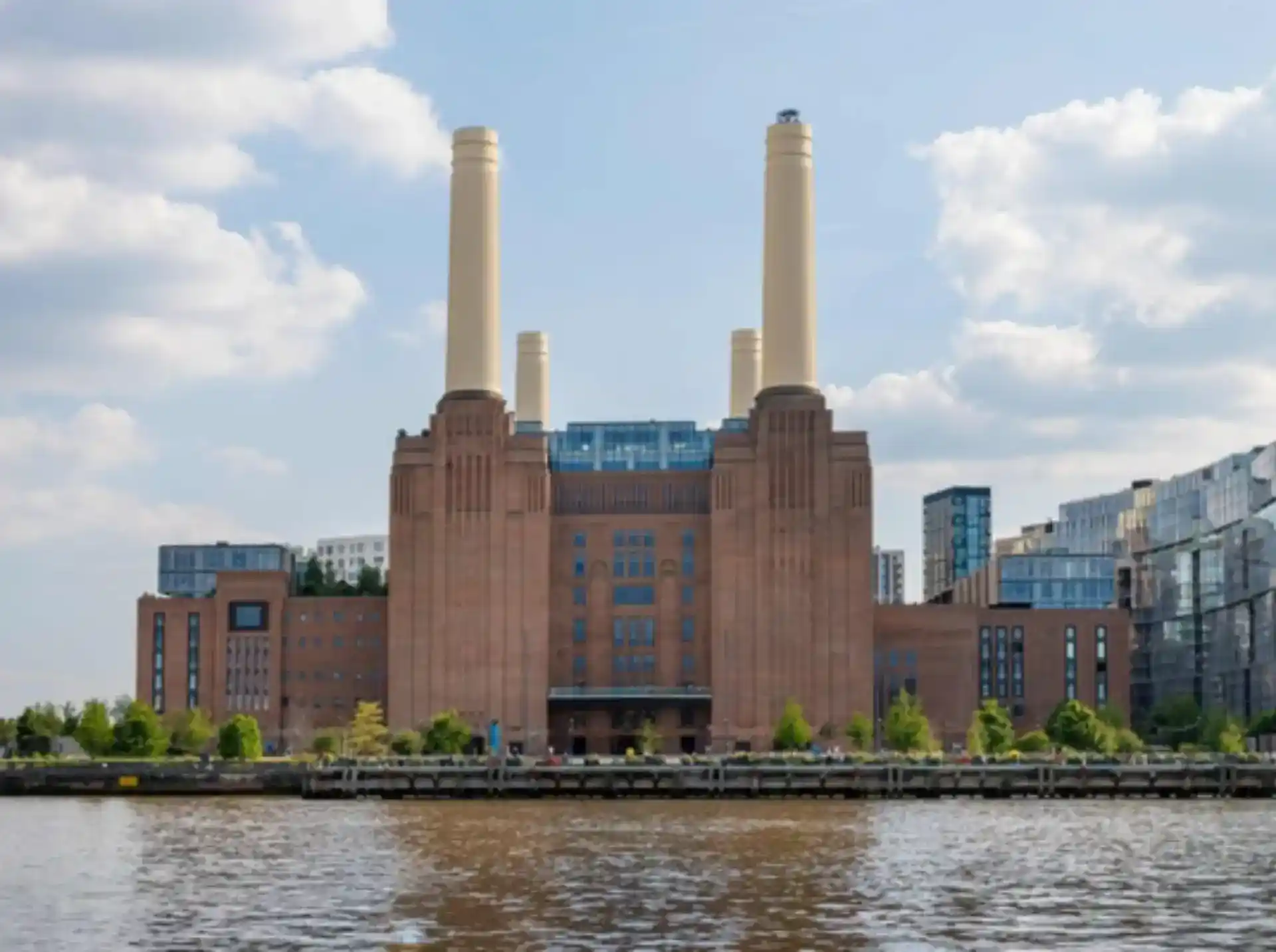 Exterior view of the iconic Battersea Power Station landmark in London, showcasing the historic facade of the residential apartments.